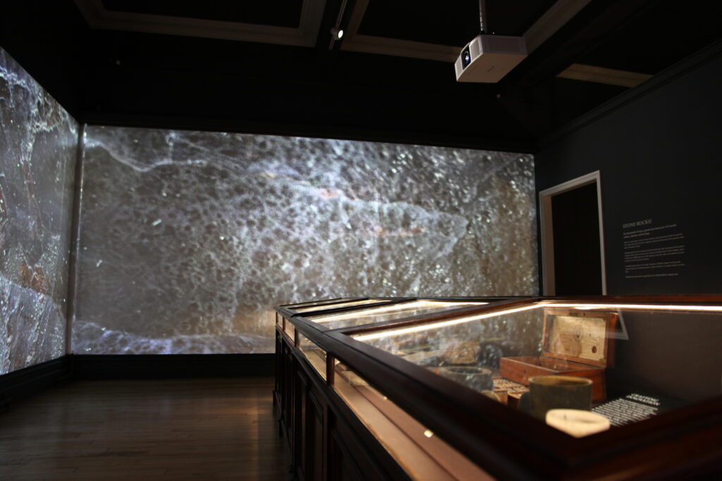 Led strip lighting cabinets with projection screen in background